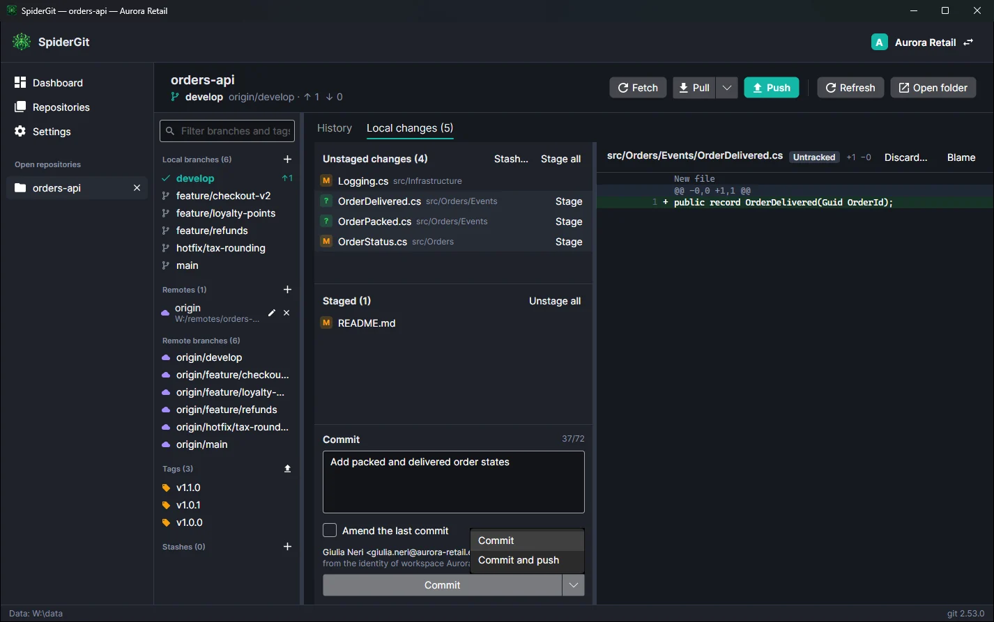Commit area with the message, the identity in use and the Commit button menu open on Commit and push.