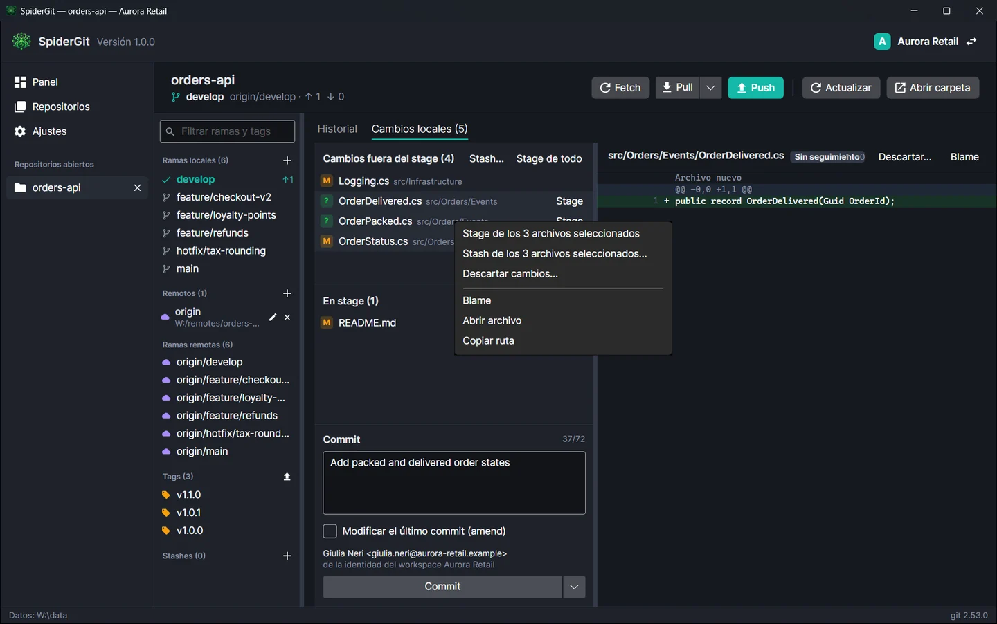 Tres archivos seleccionados en la lista de cambios con el menú contextual abierto en Stage y Stash de los archivos seleccionados.